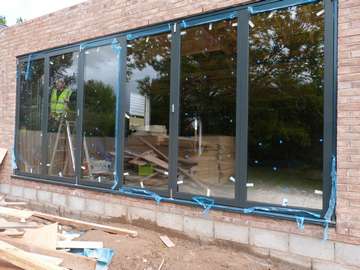 AKC Developments - Eyebrook Road Bowden - Installation of 2 sets of Centor C1 Triple glazed Bi Folding doors 9007 Alumnium Finish Example of aluminium triple glazed bi-fold doors. Aluminium bi-fold doors near Macclesfield SK11. Alumnus doors with 44mm triple glazing near Alderly Edge SK9. Aluminium Bi-fold doors near Wirral CH48 CH60. Alumnus Bi-fold doors triple glazed Liverpool Formby L37 near South Port PR8 Bi-fold doors near Crosby L23